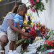 Tamara Holmes and her son Trenton Holmes lay flowers in front of Emanuel African Methodist Episcopal Church in Charleston, S.C., after a mass shooting at the church that killed nine people June 18, 2015.
Joe Raedle/Getty Images